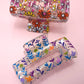 JOSSLYN by wall to wall - JUMBO FLORAL SUNFLOWER RECTANGLE HAIR CLAW CLIPS | 40H899: Blue